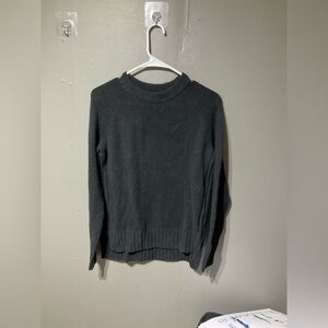 Woman’s black sweater